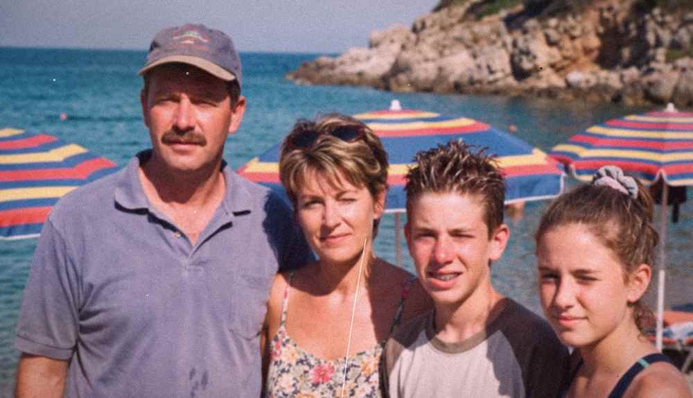 Faded old beach holiday family photo before restoration
